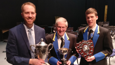 MD James Haigh, Ray Pont and principal cornet Matthew Tate picking up trophies in the spring